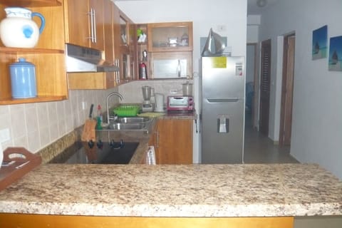 Fridge, microwave, toaster, cookware/dishes/utensils