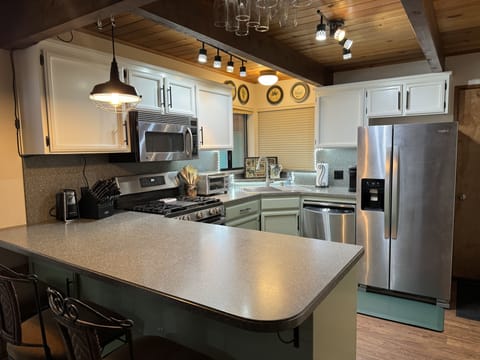 Fully stocked chef’s kitchen.