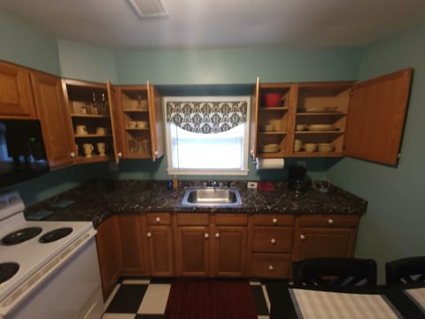 Alternate view of kitchen 1 showing dishware