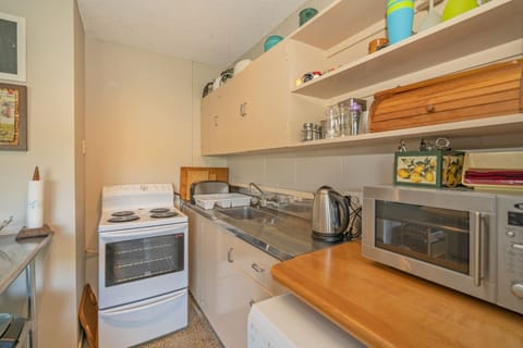 Fridge, microwave, toaster, cookware/dishes/utensils