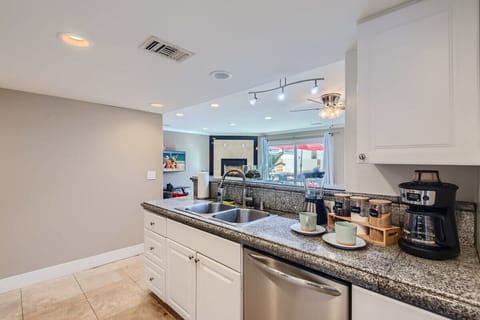 Enjoy the full kitchen with coffee, creamers, mixers, spices, refrigerator, oven, microwave, stove, pots, pans, cooking supplies, cutlery, cups, plates, bowls, utensils, small appliances, and many essentials!