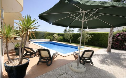 Outdoor pool, a heated pool, sun loungers