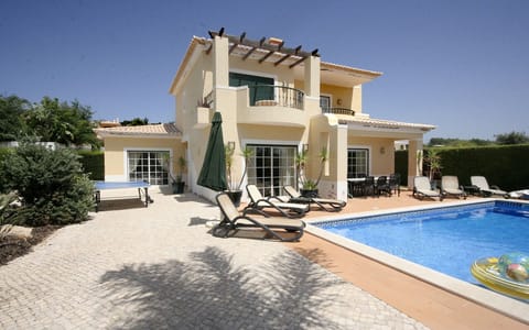 Outdoor pool, a heated pool, sun loungers