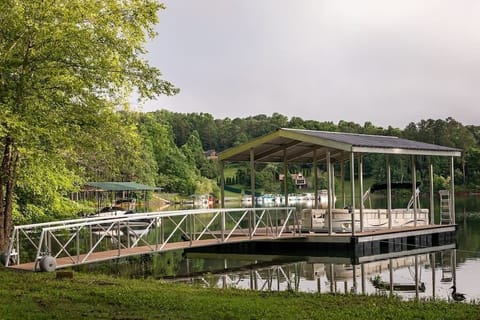 Private dock with covered boat slip and 13' swim platform - great for relaxing in your deck chair, floating in the water, chilling out and making memories.