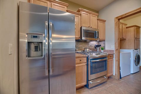 Kitchen with Refrigerator, Oven, Microwave, and Tea Kettle