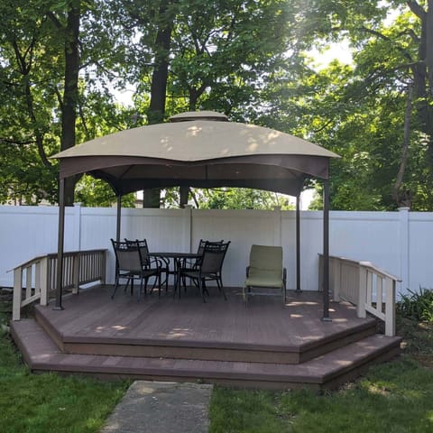 Beautiful backyard with covered patio table.