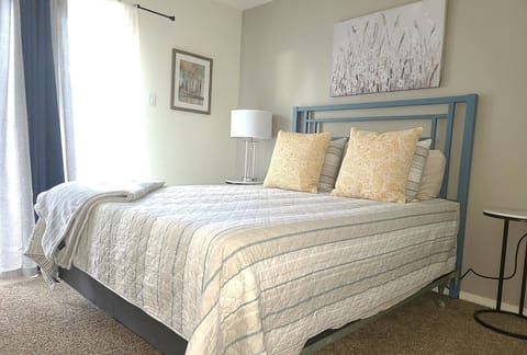 Queen bed located in private bedroom