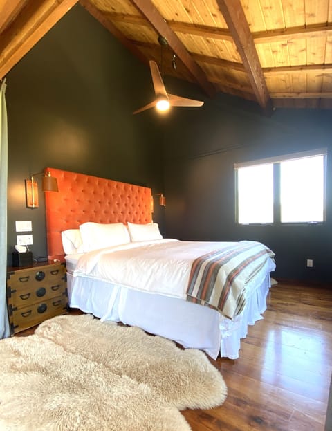 Spacious Master Suite with high peak roof and beams and views in every direction