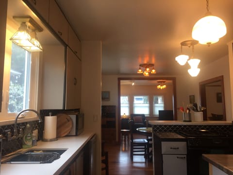 View from back of kitchen. Living room in the background