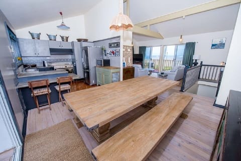 Upstairs dining area that leads out to the rear balcony.