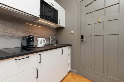 The fully equipped kitchenette includes everything you need for a home-cooked meal.