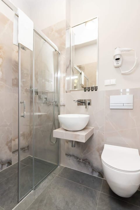 Clean and contemporary, the bathroom offers a relaxing space.
