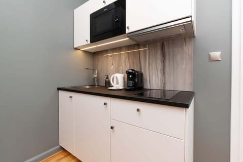 The fully equipped kitchenette includes everything you need for a home-cooked meal.