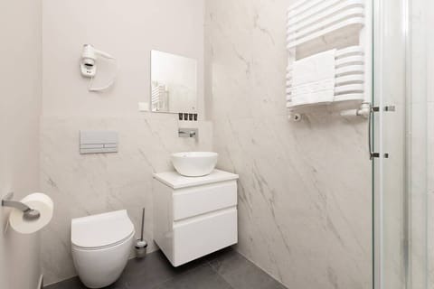 Practical and stylish, the bathroom is designed for comfort.