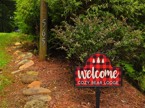 welcome sign at driveway entrance