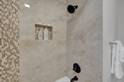 Combined shower/tub, hair dryer, towels, soap