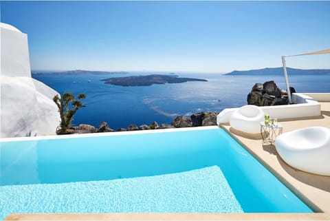 An infinity pool, a heated pool, sun loungers