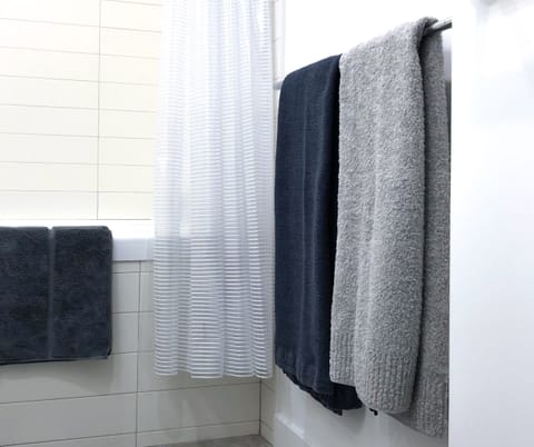 Combined shower/tub, hair dryer, towels, soap