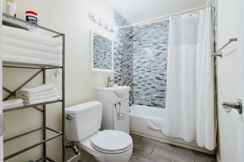 Combined shower/tub, hair dryer, towels, soap