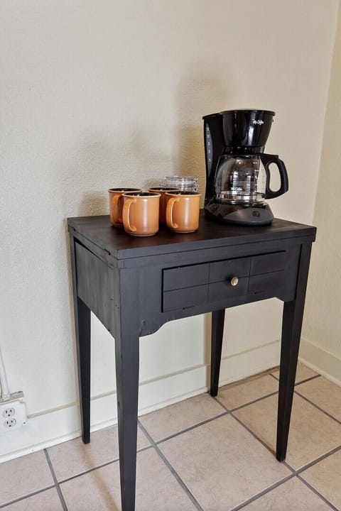Also in the kitchen, enjoy our place's coffee station complete with a coffee maker & handmade ceramic mug.
