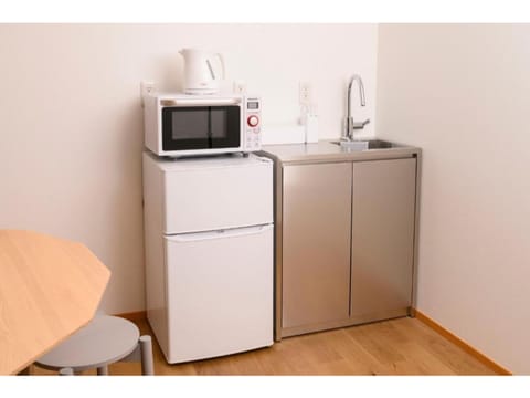 Fridge, microwave, cookware/dishes/utensils