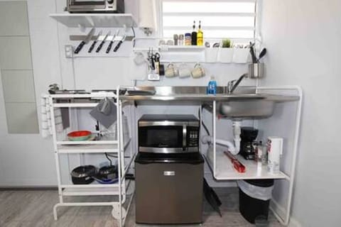 Kitchenette with two burner countertop stove w/everything else you would need.
