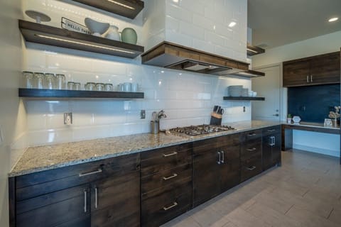 Kitchen is stocked with utensils and appliances to make cooking a breeze