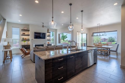 Kitchen featuring oversized island and seating for 5