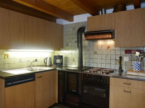 Countertop, Cabinetry, Kitchen Sink, Property, Sink, Kitchen, Kitchen Appliance, Kitchen Stove, Wood, Tap