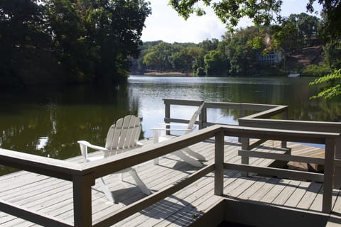 Private dock on Lake Avalon with two kayaks and a paddleboat