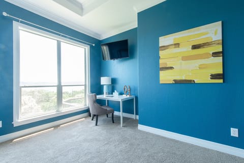 Bedroom 1 - Large master bedroom with in-room tv and desk overlooking lake views