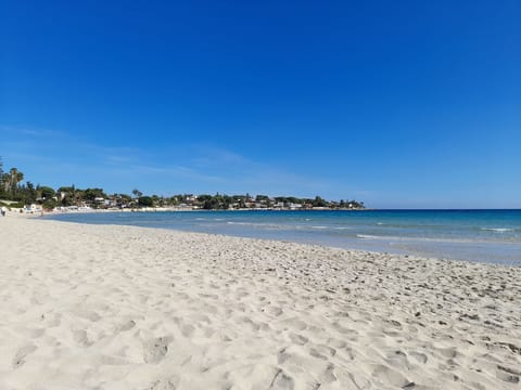 On the beach, sun loungers, beach towels