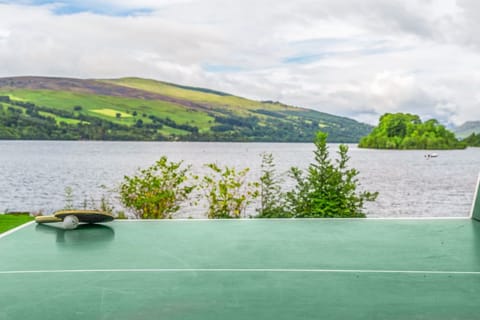 Tranquil lake view with a solitary boat, offering a peaceful retreat.