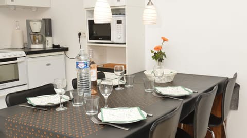 Internal dining located between kitchen and living room.