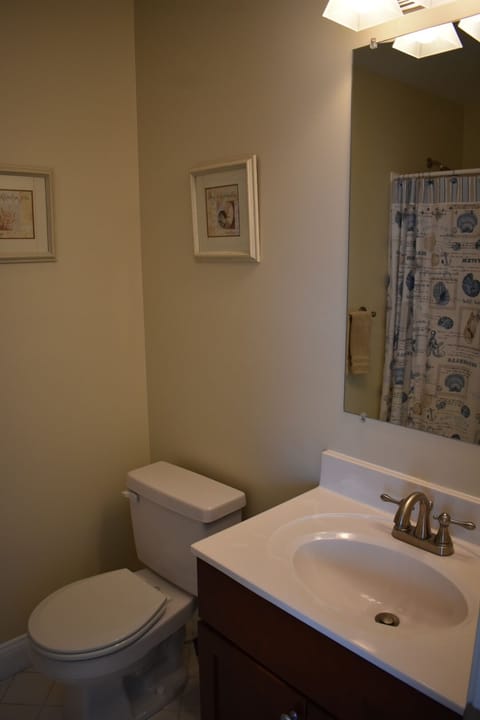 Bedroom with full bathroom including shower stall