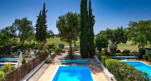 A heated pool, sun loungers