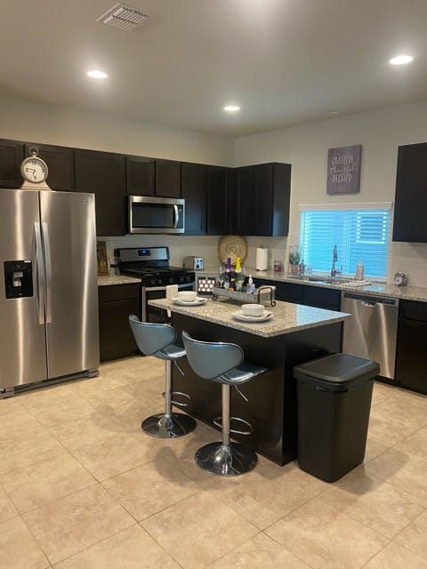 Kitchen area w Island and Lots of Counter Space w New Stainless Steel Appliance