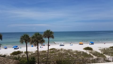 On the beach, sun loungers, beach towels