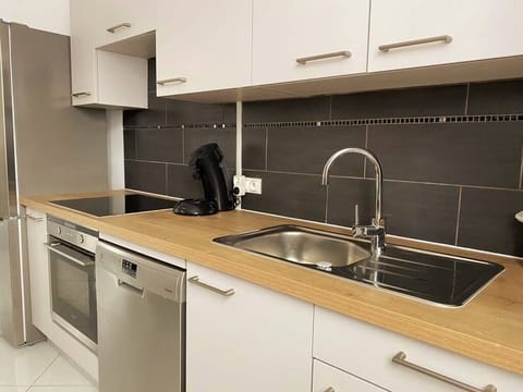 an opened and completely furnished kitchen