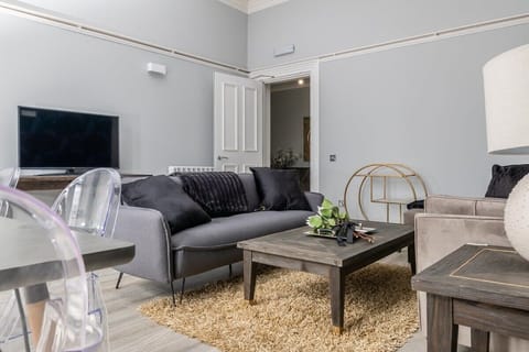 Modern, open plan lounge area with plenty of seating for guests