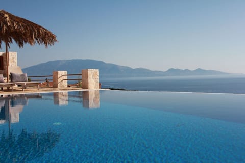 An infinity pool, sun loungers