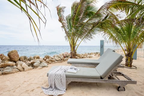 On the beach, sun loungers, beach towels