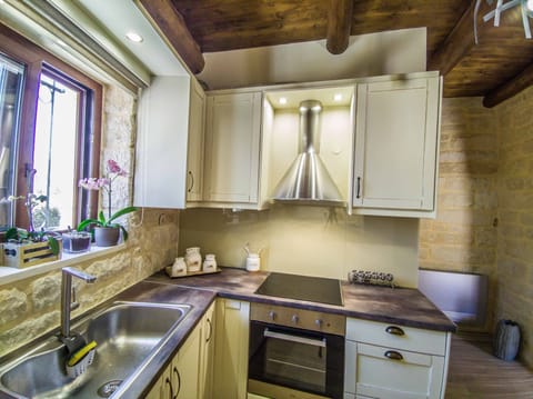 Fully equipped kitchen at the ground floor.