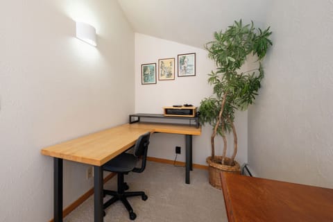 Working nook with desk located inside the top-floor master bedroom.
