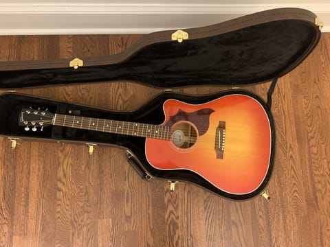 The house guitar is a Gibson Hummingbird
