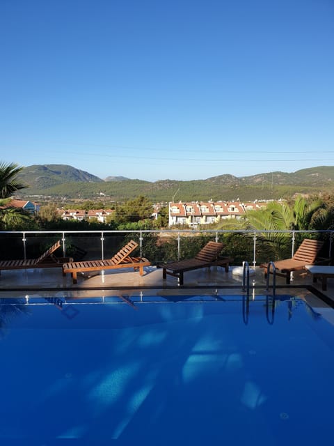 Outdoor pool, a heated pool, sun loungers