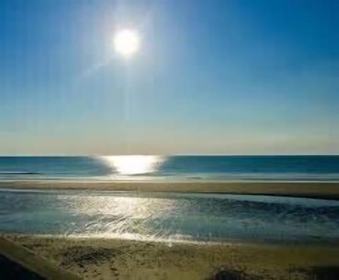 On the beach, sun loungers, beach towels