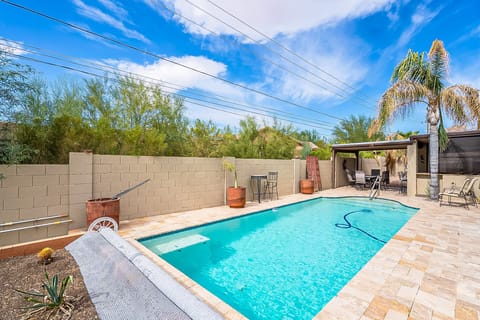 Stunning pool, landscaping and patio with paver stones to enjoy the gorgeous Arizona sunshine.
