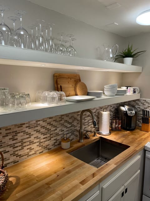Accent lights under the kitchen shelves.