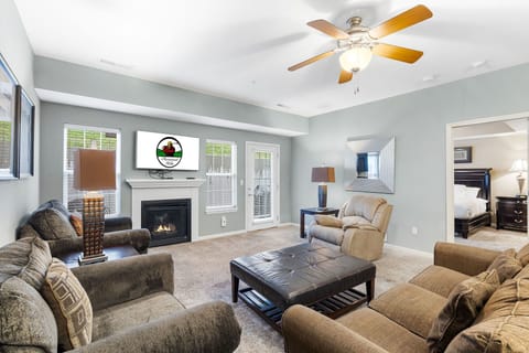 Living Area with Sleeper Sofa, Seasonal Fireplace, Cable, and Patio Access